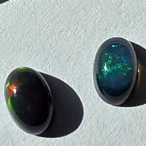 Black and green welo fire opals